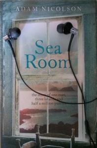 Adam Nicolson's "Sea Room" with headphones resting on it